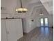 Bright living room with high ceilings, tile floors, and sliding barn door at 2201 Club Cir # 2201, Lake Wales, FL 33898