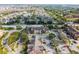 Drone shot of a residential apartment complex with expansive parking, green spaces, and surrounding community at 2203 Key West Ct # 435, Kissimmee, FL 34741
