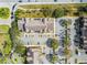 Overhead view of an apartment building with a full parking area, trees and sidewalks at 2203 Key West Ct # 435, Kissimmee, FL 34741