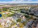 Aerial view of an apartment complex near a lake, showcasing building exteriors and surrounding neighborhood at 2203 Key West Ct # 435, Kissimmee, FL 34741