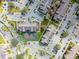 Bird's-eye perspective of a community featuring a tennis court, plentiful parking, and attractive building exteriors at 2203 Key West Ct # 435, Kissimmee, FL 34741