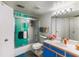 Well-lit bathroom featuring a shower-tub combo, a toilet and vanity with modern fixtures and bright lighting at 2203 Key West Ct # 435, Kissimmee, FL 34741