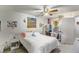 Bright bedroom offering a queen bed, a ceiling fan, a workspace and natural light creating a functional and cozy atmosphere at 2203 Key West Ct # 435, Kissimmee, FL 34741