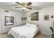 Inviting bedroom featuring a queen bed, ceiling fan, and natural light, creating a comfortable and relaxing space at 2203 Key West Ct # 435, Kissimmee, FL 34741