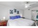 Bright bedroom showcasing a bed with white linens, side tables with lamps, and a ceiling fan at 2203 Key West Ct # 435, Kissimmee, FL 34741
