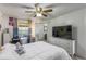 Bedroom with a queen bed, dresser, and a view of a hallway at 2203 Key West Ct # 435, Kissimmee, FL 34741