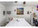 Well-lit bedroom with a queen bed, ceiling fan, and a workspace, offering a blend of comfort and practicality at 2203 Key West Ct # 435, Kissimmee, FL 34741