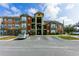 Apartment building exterior with ample parking at 2203 Key West Ct # 435, Kissimmee, FL 34741