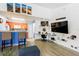 Stylish living room showcasing modern furnishings, colorful artwork, and a functional workspace at 2203 Key West Ct # 435, Kissimmee, FL 34741