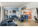 Bright living room featuring blue walls, modern furnishings, and an open layout to the kitchen at 2203 Key West Ct # 435, Kissimmee, FL 34741