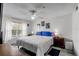 Relaxing main bedroom with a comfortable bed, ceiling fan, and soft natural light through the window at 2203 Key West Ct # 435, Kissimmee, FL 34741