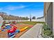 Backyard features a play area, fire pit, and patio perfect for entertaining guests at 2849 Shelburne Way, St Cloud, FL 34772