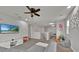 Upstairs bonus room with plush carpet, entertainment center and sofa offers a cozy and inviting space at 2849 Shelburne Way, St Cloud, FL 34772