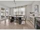 Bright dining area with a modern table and chairs, perfect for Gathering meals and entertaining at 2849 Shelburne Way, St Cloud, FL 34772