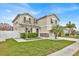 Charming two-story home with a well-maintained lawn and beautiful landscaping at 2849 Shelburne Way, St Cloud, FL 34772