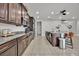 Stylish kitchen with granite counters, stainless appliances, and an open layout to the dining area at 2849 Shelburne Way, St Cloud, FL 34772