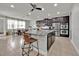 Open kitchen boasts a large island, stainless steel appliances, and ample cabinet space at 2849 Shelburne Way, St Cloud, FL 34772