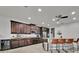 Spacious kitchen with stainless steel appliances, granite countertops, and a breakfast bar at 2849 Shelburne Way, St Cloud, FL 34772