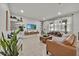 Cozy living room with modern decor, tile floors, and a comfortable seating area at 2849 Shelburne Way, St Cloud, FL 34772