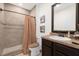 Clean bathroom with shower, toilet and granite countertop vanity at 3027 Serendipity Way, Davenport, FL 33896