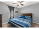 Comfortable bedroom with a king-size bed and blue striped bedding at 3027 Serendipity Way, Davenport, FL 33896