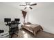 Cozy bedroom with a twin-size bed and home office setup at 3027 Serendipity Way, Davenport, FL 33896