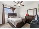 Bright bedroom with a double bed, dresser, and large window at 3027 Serendipity Way, Davenport, FL 33896