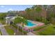 Community pool area with surrounding landscaping at 3027 Serendipity Way, Davenport, FL 33896