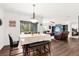 Casual dining area with table, chairs, and view into living room and bedroom at 3027 Serendipity Way, Davenport, FL 33896