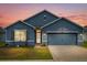 Stunning curb appeal! This move-in ready home features a two-car garage and attractive landscaping at 3027 Serendipity Way, Davenport, FL 33896