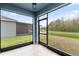 Relaxing screened porch overlooking a tranquil pond at 3027 Serendipity Way, Davenport, FL 33896