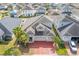 House with gray roof and red brick driveway, in a neighborhood at 3040 Cardillino Way, Kissimmee, FL 34741