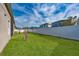 Spacious backyard with grassy lawn and privacy fence at 3040 Cardillino Way, Kissimmee, FL 34741