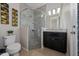 Bathroom with a large walk-in shower and dark vanity at 3040 Cardillino Way, Kissimmee, FL 34741