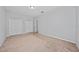 Well-lit bedroom with neutral walls and carpet flooring at 3040 Cardillino Way, Kissimmee, FL 34741