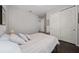 Cozy bedroom with striped bedding and dark hardwood floors at 3040 Cardillino Way, Kissimmee, FL 34741