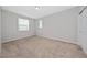 Bright bedroom featuring neutral decor and carpet flooring at 3040 Cardillino Way, Kissimmee, FL 34741