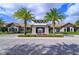 Community clubhouse with inviting entrance and landscaping at 3040 Cardillino Way, Kissimmee, FL 34741