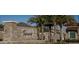 Tapestry community entrance with stonework and palm trees at 3040 Cardillino Way, Kissimmee, FL 34741