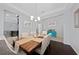 Spacious dining room with dark hardwood floors and wood table at 3040 Cardillino Way, Kissimmee, FL 34741