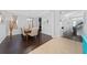 Dining room features hardwood floors and a view to kitchen at 3040 Cardillino Way, Kissimmee, FL 34741