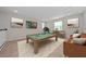 Game room with pool table, comfortable seating, and artwork at 3040 Cardillino Way, Kissimmee, FL 34741