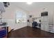 Bright home office features built-in shelving and hardwood floors at 3040 Cardillino Way, Kissimmee, FL 34741