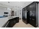 Modern kitchen with stainless steel appliances and a large island at 3040 Cardillino Way, Kissimmee, FL 34741