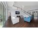 Open concept living room with hardwood floors and high ceilings at 3040 Cardillino Way, Kissimmee, FL 34741