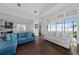 Spacious living room with hardwood floors and sliding glass doors leading to patio at 3040 Cardillino Way, Kissimmee, FL 34741
