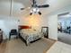 Bright bedroom with a double bed and ceiling fan at 312 2Nd St, Orlando, FL 32824