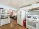 Kitchen with white appliances, ample cabinetry, and a view into the living area at 312 2Nd St, Orlando, FL 32824