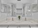 Double vanity bathroom with modern sinks and large mirrors at 3224 Fairfield Dr, Kissimmee, FL 34743