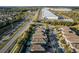 An aerial view showcases a neighborhood with a private pools in many homes and adjacent to commercial areas at 350 Pendant Ct, Kissimmee, FL 34747